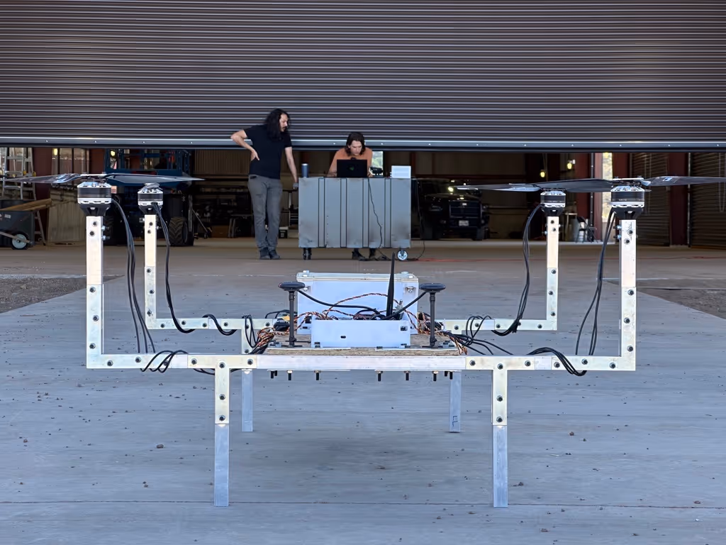 Arrow contributors gathered at a hangar flight test