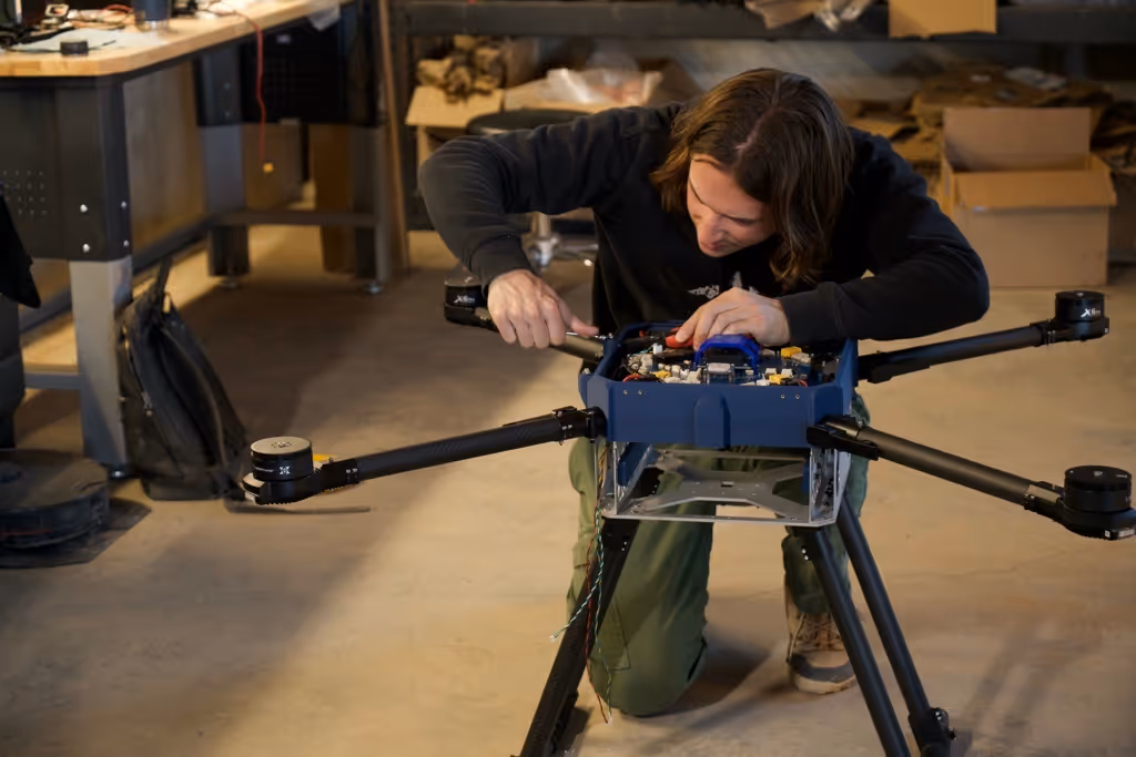 Arrow contributor assembling drone hardware